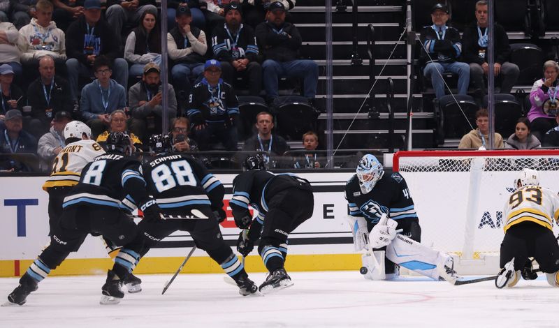Oct 19, 2025; Salt Lake City, Utah, USA; Utah Mammoth goaltender Vitek Vanecek (41) blocks a shot by Boston Bruins center Michael Eyssimont (81) during the first period at Delta Center. Mandatory Credit: Rob Gray-Imagn Images