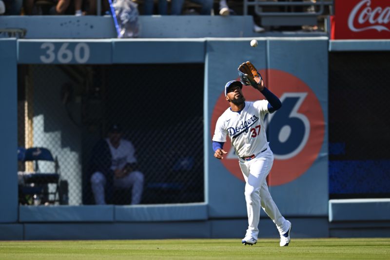 Apr 20, 2024; Los Angeles, California, USA; Los Angeles Dodgers outfielder Teoscar Hernandez (37) makes a catch at first base against the New York Mets during the ninth inning at Dodger Stadium. Mandatory Credit: Jonathan Hui-USA TODAY Sports