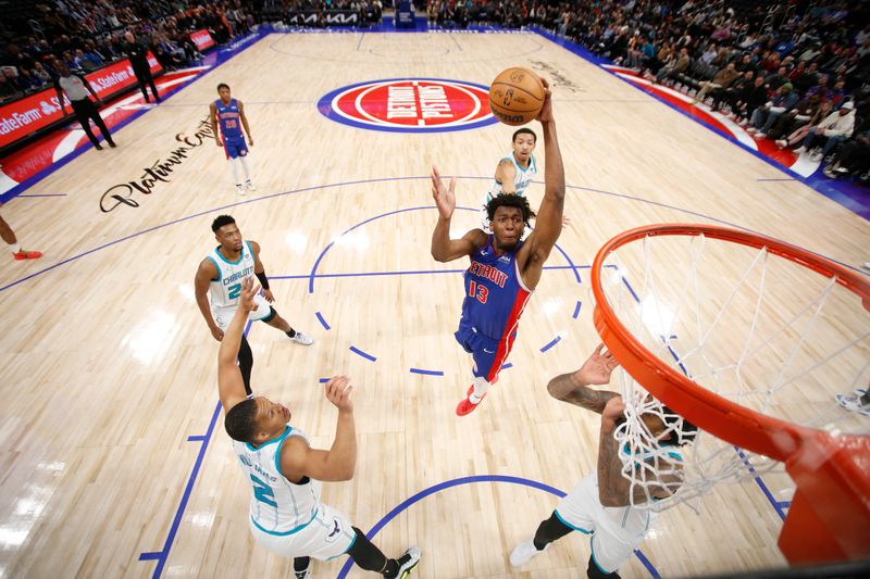 DETROIT, MI - March 11: James Wiseman #13 of the Detroit Pistons drives to the basket during the game against the Charlotte Hornets on March 11, 2024 at Little Caesars Arena in Detroit, Michigan. NOTE TO USER: User expressly acknowledges and agrees that, by downloading and/or using this photograph, User is consenting to the terms and conditions of the Getty Images License Agreement. Mandatory Copyright Notice: Copyright 2024 NBAE (Photo by Brian Sevald/NBAE via Getty Images)