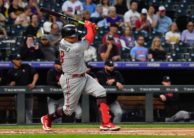 Sep 30, 2023; Denver, Colorado, USA; Minnesota Twins catcher Christian Vazquez (8) singles to center field in the second inning against the Colorado Rockies at Coors Field. Mandatory Credit: John Leyba-USA TODAY Sports