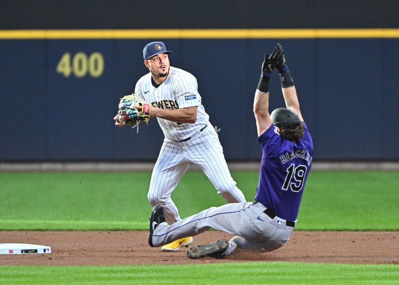 Sep 7, 2024; Milwaukee, Wisconsin, USA; Milwaukee Brewers shortstop Willy Adames (27) gets the force at second base against Colorado Rockies outfielder Charlie Blackmon (19) but can’t complete the double play in the first inning at American Family Field. Mandatory Credit: Michael McLoone-Imagn Images