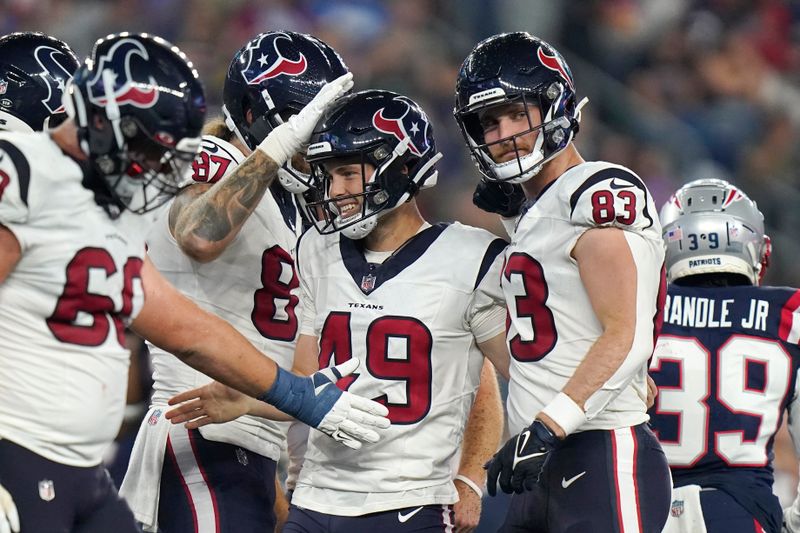 Houston Texans' Jake Bates (49) is congratulated after his extra-point conversion against the New England Patriots during the first half of an NFL preseason football game Thursday, Aug. 10, 2023, in Foxborough, Mass. (AP Photo/Steven Senne)