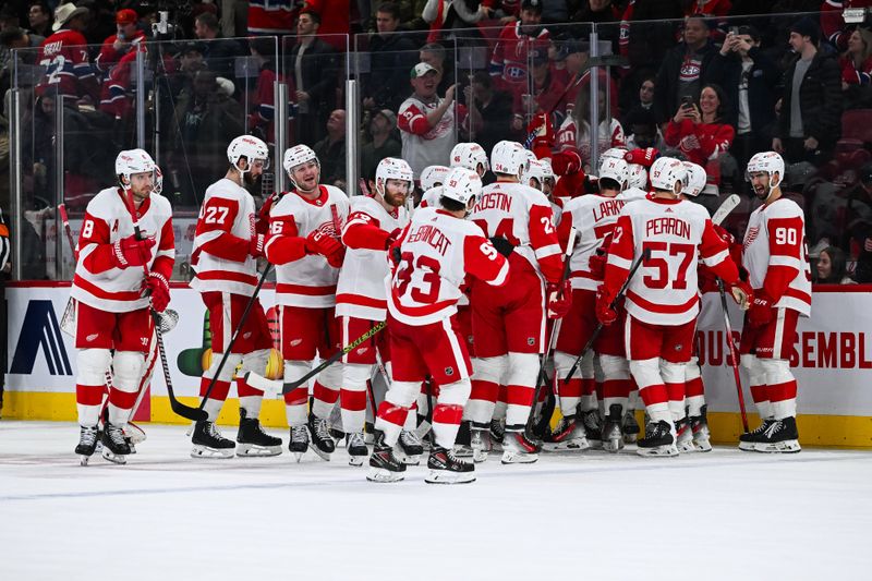 Dec 2, 2023; Montreal, Quebec, CAN; Detroit Red Wings players gather to celebrate the overtime win against the Montreal Canadiens at Bell Centre. Mandatory Credit: David Kirouac-USA TODAY Sports