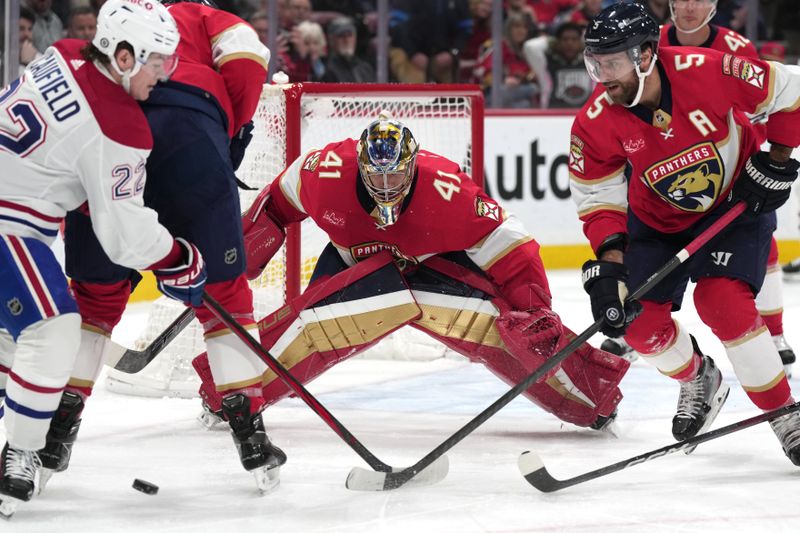 Dec 30, 2023; Sunrise, Florida, USA; Florida Panthers goaltender Anthony Stolarz (41) keeps an eye on the puck during the first period against the Montreal Canadiens at Amerant Bank Arena. Mandatory Credit: Jim Rassol-USA TODAY Sports