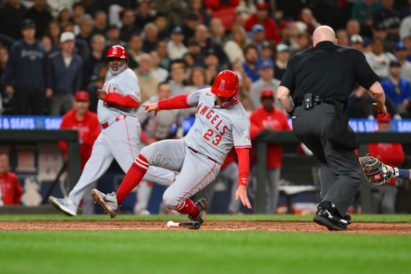 Jul 22, 2024; Seattle, Washington, USA; Los Angeles Angels second baseman Brandon Drury (23) scores a run against the Seattle Mariners during the ninth inning at T-Mobile Park. Mandatory Credit: Steven Bisig-USA TODAY Sports