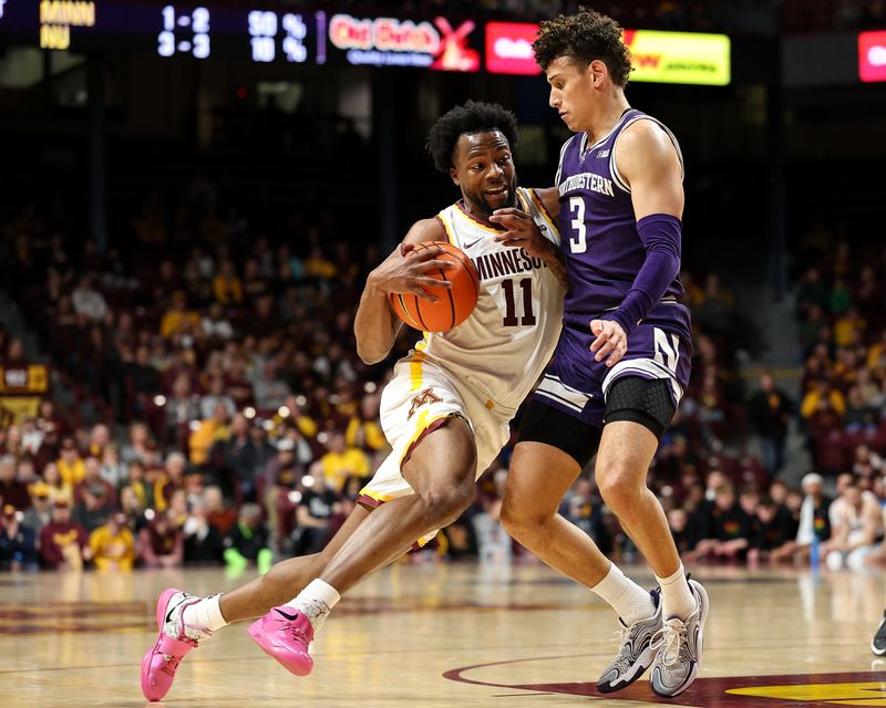 Feb 25, 2025; Minneapolis, Minnesota, USA; Minnesota Golden Gophers guard Femi Odukale (11) works around Northwestern Wildcats guard Ty Berry (3) during the first half at Williams Arena. Mandatory Credit: Matt Krohn-Imagn Images