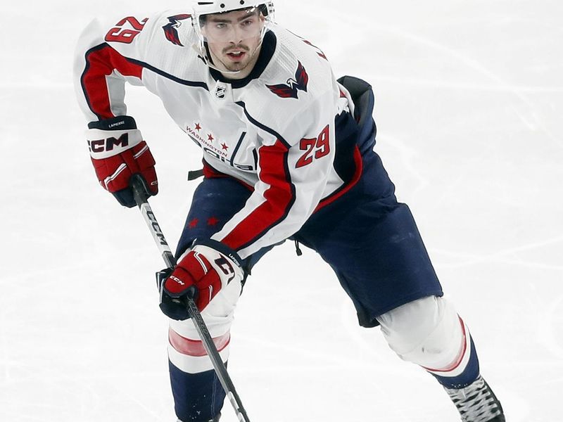 Mar 7, 2024; Pittsburgh, Pennsylvania, USA; Washington Capitals center Hendrix Lapierre (29) skates up ice with the puck against the Pittsburgh Penguins during the third period at PPG Paints Arena. The Capitals shutout the Penguins 6-0. Mandatory Credit: Charles LeClaire-USA TODAY Sports