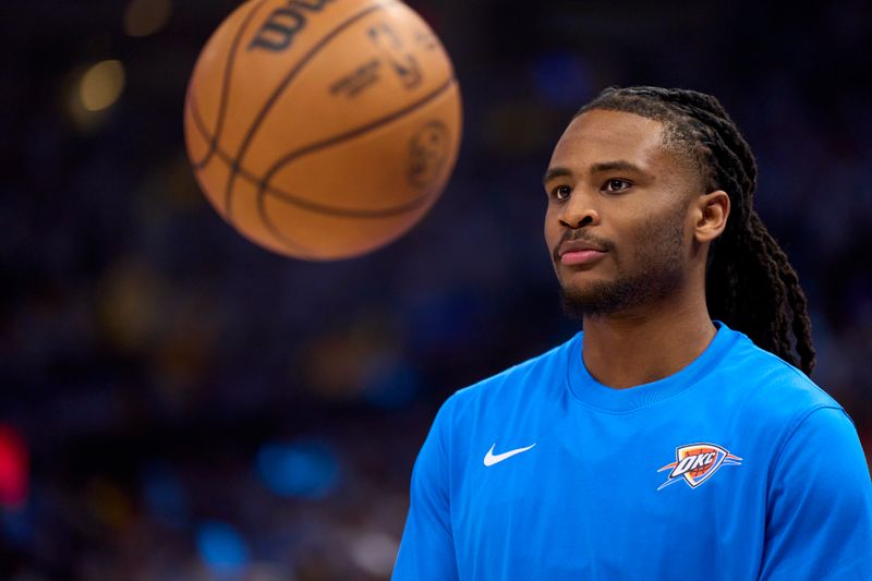 OKLAHOMA CITY, OKLAHOMA - APRIL 21: Cason Wallace #22 of the Oklahoma City Thunder warms up before tipoff against the New Orleans Pelicans in game one of the Western Conference First Round Playoffs at the Paycom Center on April 21, 2024 in Oklahoma City, Oklahoma. NOTE TO USER: User expressly acknowledges and agrees that, by downloading and or using this photograph, User is consenting to the terms and conditions of the Getty Images License Agreement.  (Photo by Cooper Neill/Getty Images)