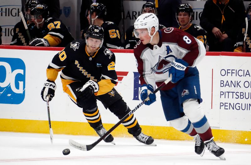 Oct 26, 2023; Pittsburgh, Pennsylvania, USA; Colorado Avalanche defenseman Cale Makar (8) moves the puck against Pittsburgh Penguins center Lars Eller (20) during the third period at PPG Paints Arena. The Penguins shutout the Avalanche 4-0. Mandatory Credit: Charles LeClaire-USA TODAY Sports