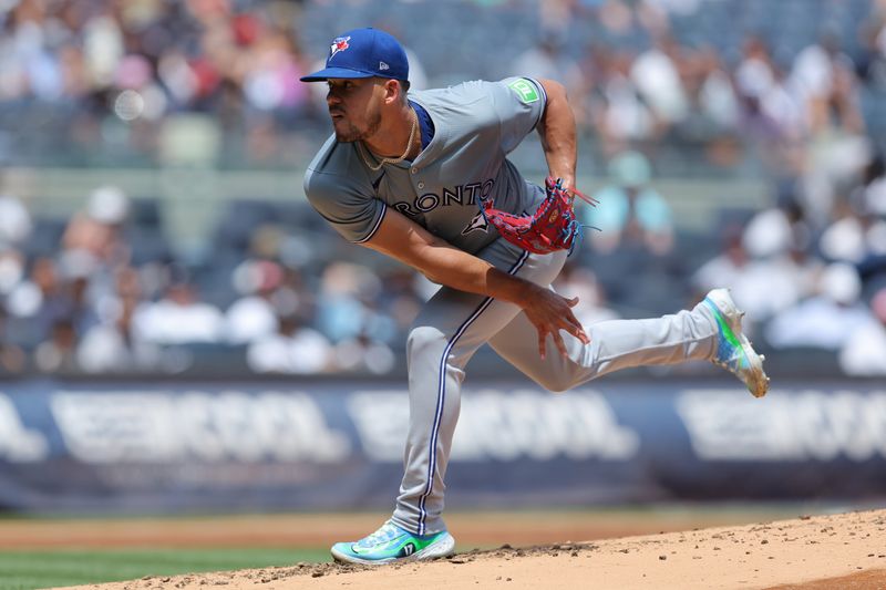 Aug 3, 2024; Bronx, New York, USA; Toronto Blue Jays starting pitcher Jose Berrios (17) follows through on a pitch against the New York Yankees during the first inning at Yankee Stadium. Mandatory Credit: Brad Penner-USA TODAY Sports