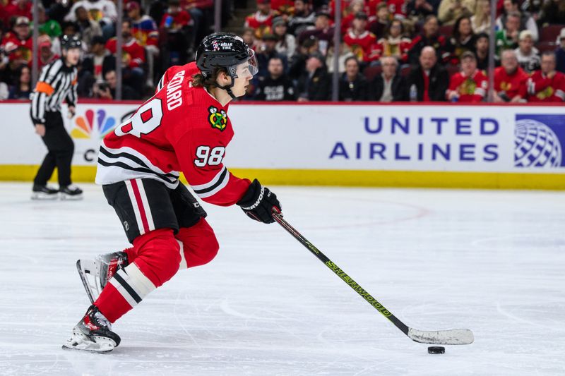 Dec 10, 2023; Chicago, Illinois, USA; Chicago Blackhawks center Connor Bedard (98) skates with the puck against the Washington Capitals during the second period at the United Center. Mandatory Credit: Daniel Bartel-USA TODAY Sports