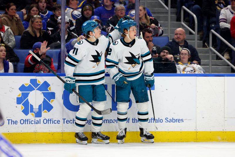 Mar 4, 2025; Buffalo, New York, USA;  San Jose Sharks center Will Smith (2) celebrates his goal with center Macklin Celebrini (71) during the third period against the Buffalo Sabres at KeyBank Center. Mandatory Credit: Timothy T. Ludwig-Imagn Images