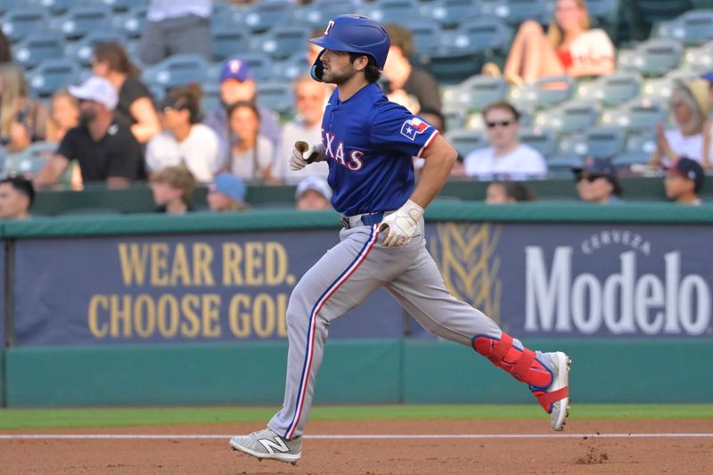 Jul 9, 2024; Anaheim, California, USA;  Texas Rangers third baseman Josh Smith (8) rounds the bases on a solo home run in the first inning against the Los Angeles Angels at Angel Stadium. Mandatory Credit: Jayne Kamin-Oncea-USA TODAY Sports