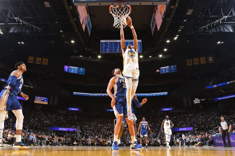 SAN FRANCISCO, CA - MARCH 24: Jordan Poole #3 of the Golden State Warriors drives to the basket during the game against the Philadelphia 76ers on March 24, 2023 at Chase Center in San Francisco, California. NOTE TO USER: User expressly acknowledges and agrees that, by downloading and or using this photograph, user is consenting to the terms and conditions of Getty Images License Agreement. Mandatory Copyright Notice: Copyright 2023 NBAE (Photo by Noah Graham/NBAE via Getty Images)