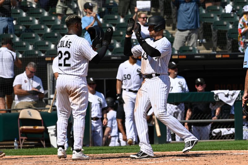 Aug 23, 2023; Chicago, Illinois, USA;  Chicago White Sox center fielder Trayce Thompson (43) celebrates his two run home run with Chicago White Sox right fielder Oscar Colas (22) against the Seattle Mariners during the sixth inning at Guaranteed Rate Field. Mandatory Credit: Matt Marton-USA TODAY Sports