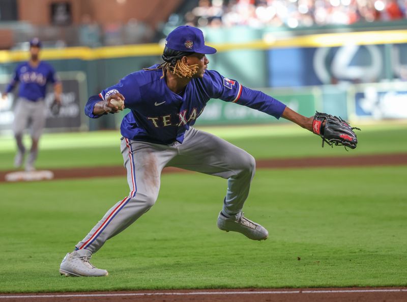 Apr 13, 2024; Houston, Texas, USA; Texas Rangers pitcher Jose Urena (54) can’t field Houston Astros center fielder Jake Meyers (6) bunt in time in the seventh inning at Minute Maid Park. Mandatory Credit: Thomas Shea-USA TODAY Sports