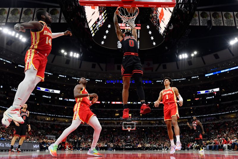 CHICAGO, ILLINOIS - APRIL 04: Coby White #0 of the Chicago Bulls shoots against the Atlanta Hawks at United Center on April 04, 2023 in Chicago, Illinois. NOTE TO USER: User expressly acknowledges and agrees that, by downloading and or using this photograph, User is consenting to the terms and conditions of the Getty Images License Agreement.  (Photo by Quinn Harris/Getty Images)