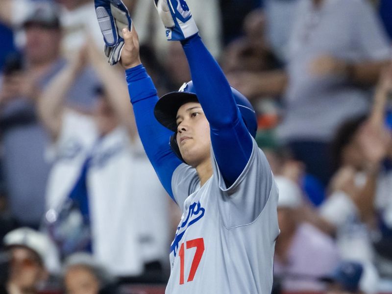 Sep 23, 2025; Phoenix, Arizona, USA; Los Angeles Dodgers pitcher/designated hitter Shohei Ohtani celebrates after scoring in the sixth inning against the Arizona Diamondbacks at Chase Field. Mandatory Credit: Mark J. Rebilas-Imagn Images