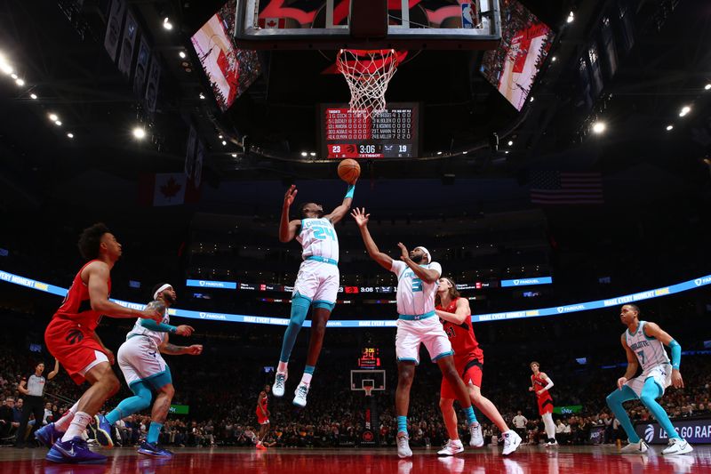 TORONTO, CANADA - MARCH 3: Brandon Miller #24 of the Charlotte Hornets rebounds the ball during the game against the Toronto Raptors on March 3, 2024 at the Scotiabank Arena in Toronto, Ontario, Canada.  NOTE TO USER: User expressly acknowledges and agrees that, by downloading and or using this Photograph, user is consenting to the terms and conditions of the Getty Images License Agreement.  Mandatory Copyright Notice: Copyright 2024 NBAE (Photo by Vaughn Ridley/NBAE via Getty Images)