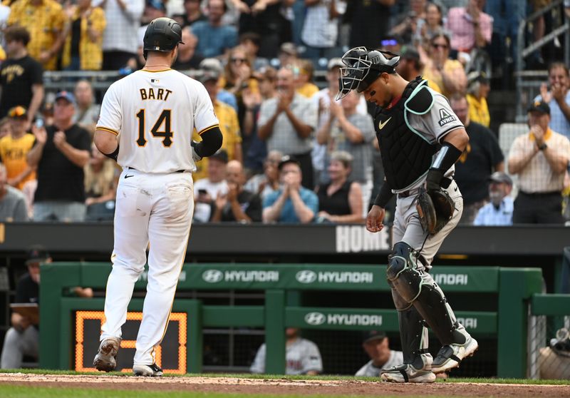 Aug 3, 2024; Pittsburgh, Pennsylvania, USA;  Pittsburgh Pirates batter Joey Bart (14) crosses home plate in front of Arizona Diamondbacks catcher Gabriel Moreno(14) after hitting a solo home run in the second inning at PNC Park. Mandatory Credit: Philip G. Pavely-USA TODAY Sports