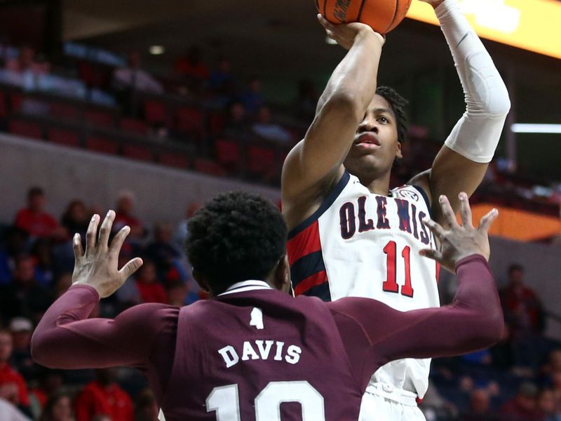 Feb 18, 2023; Oxford, Mississippi, USA; Mississippi Rebels guard Matthew Murrell (11) shoots for three during overtime against the Mississippi State Bulldogs at The Sandy and John Black Pavilion at Ole Miss. Mandatory Credit: Petre Thomas-USA TODAY Sports