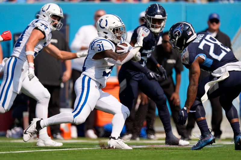 Indianapolis Colts running back Tyler Goodson (31) runs for a first dow during the first half of an NFL football game against the Tennessee Titans, Sunday, Oct. 13, 2024, in Nashville, Tenn. (AP Photo/George Walker IV)