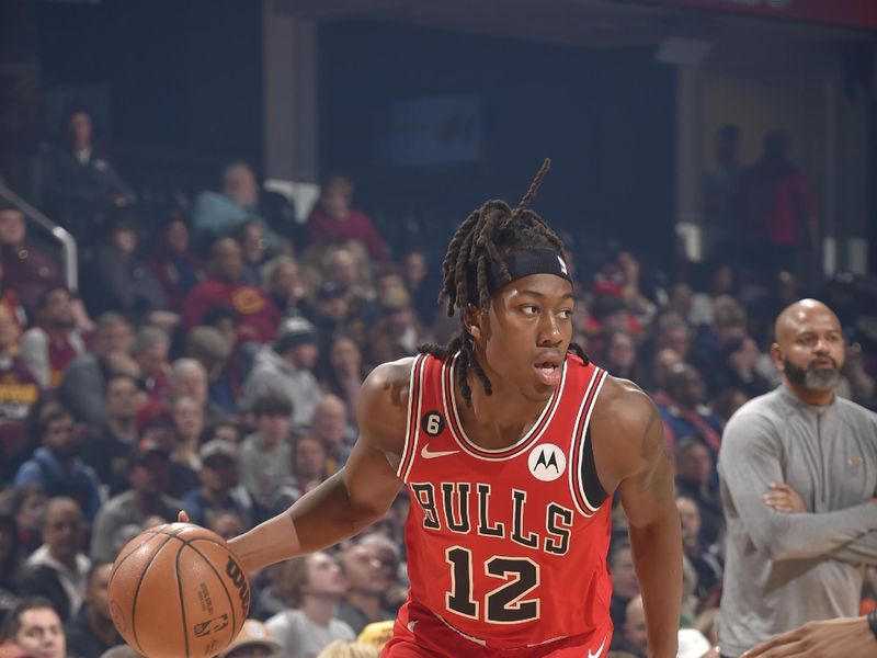 CLEVELAND, OH - FEBRUARY 11: Ayo Dosunmu #12 of the Chicago Bulls dribbles the ball during the game against the Cleveland Cavaliers on February 11, 2023 at Rocket Mortgage FieldHouse in Cleveland, Ohio. NOTE TO USER: User expressly acknowledges and agrees that, by downloading and/or using this Photograph, user is consenting to the terms and conditions of the Getty Images License Agreement. Mandatory Copyright Notice: Copyright 2023 NBAE (Photo by David Liam Kyle/NBAE via Getty Images)