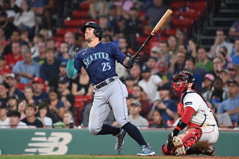 Jul 29, 2024; Boston, Massachusetts, USA; Seattle Mariners shortstop Dylan Moore (25) hits an RBI single against the Boston Red Sox during the eighth inning at Fenway Park. Mandatory Credit: Eric Canha-USA TODAY Sports