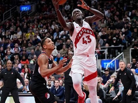 TORONTO, ON - OCTOBER 30: Pascal Siakam #43 of the Toronto Raptors goes to the basket against Malcolm Brogdon #11 of the Portland Trail Blazers during the second half of their basketball game at the Scotiabank Arena on October 30, 2023 in Toronto, Ontario, Canada. NOTE TO USER: User expressly acknowledges and agrees that, by downloading and/or using this Photograph, user is consenting to the terms and conditions of the Getty Images License Agreement. (Photo by Mark Blinch/Getty Images)