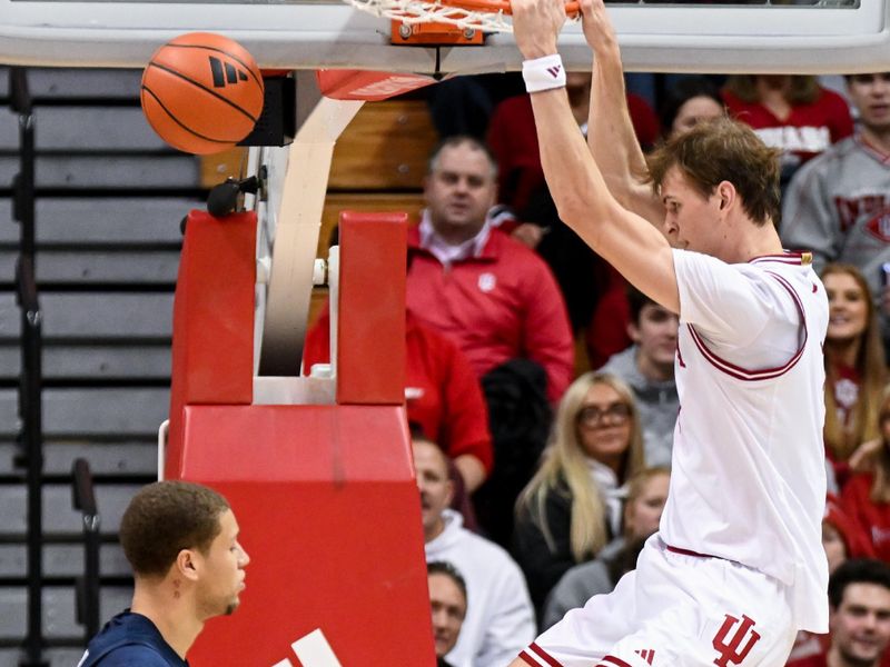 Dec 9, 2025; Bloomington, Indiana, USA; Indiana Hoosiers forward Reed Bailey (1) dunks the ball during the second half against the Penn State Nittany Lions at Simon Skjodt Assembly Hall. Mandatory Credit: Robert Goddin-Imagn Images