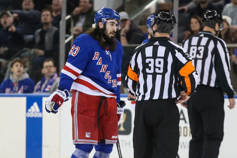 Nov 12, 2023; New York, New York, USA; New York Rangers center Mika Zibanejad (93) argues with referee Brandon Blandina (39) in the first period against the Columbus Blue Jackets at Madison Square Garden. Mandatory Credit: Wendell Cruz-USA TODAY Sports