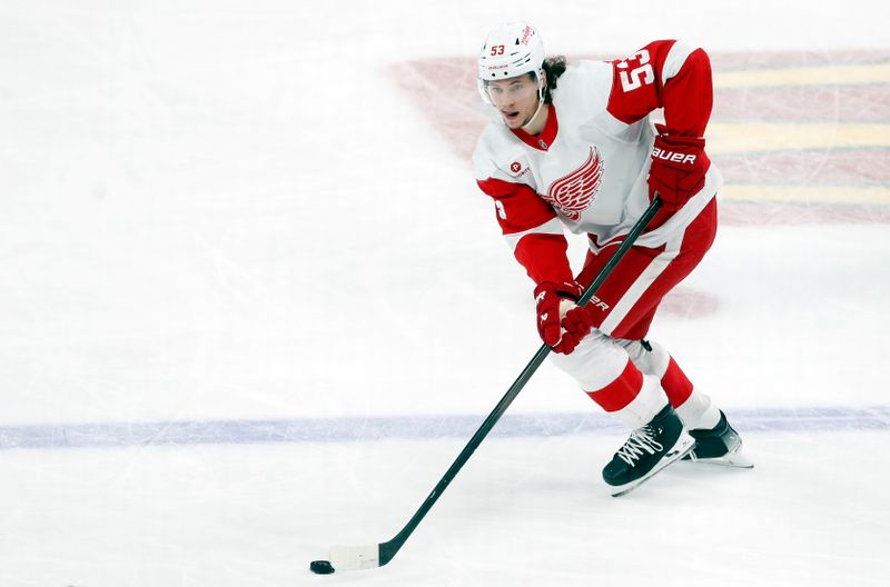 Mar 17, 2024; Pittsburgh, Pennsylvania, USA;  Detroit Red Wings defenseman Moritz Seider (53) handles the puck against the Pittsburgh Penguins during the third period at PPG Paints Arena.  Pittsburgh won 6-3.Mandatory Credit: Charles LeClaire-USA TODAY Sports