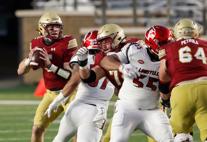 Nov 28, 2020; Chestnut Hill, Massachusetts, USA; Boston College Eagles quarterback Phil Jurkovec (5) looks to pass against the Louisville Cardinals during the first half at Alumni Stadium. Mandatory Credit: Winslow Townson-USA TODAY Sports