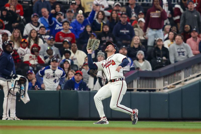 Apr 6, 2024; Atlanta, Georgia, USA; Atlanta Braves left fielder Jarred Kelenic (24) catches a fly ball against the Arizona Diamondbacks in the eighth inning at Truist Park. Mandatory Credit: Brett Davis-USA TODAY Sports
