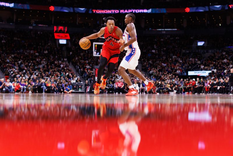 TORONTO, CANADA - OCTOBER 25: Scottie Barnes #4 of the Toronto Raptors drives against Tyrese Maxey #0 of the Philadelphia 76ers during the second half of their NBA game at Scotiabank Arena on October 25, 2024 in Toronto, Ontario, Canada. NOTE TO USER: User expressly acknowledges and agrees that, by downloading and or using this photograph, User is consenting to the terms and conditions of the Getty Images License Agreement. (Photo by Cole Burston/Getty Images)