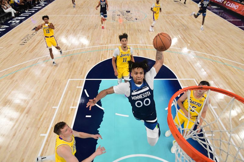 PALM SPRINGS, CA - OCTOBER 4: Terrence Shannon #00 of the Minnesota Timberwolves dunks the ball during the game against the Los Angeles Lakers during an NBA preseason game on October 4, 2024 at Acrisure Arena in Palm Springs, California. NOTE TO USER: User expressly acknowledges and agrees that, by downloading and/or using this Photograph, user is consenting to the terms and conditions of the Getty Images License Agreement. Mandatory Copyright Notice: Copyright 2024 NBAE (Photo by Adam Pantozzi/NBAE via Getty Images)