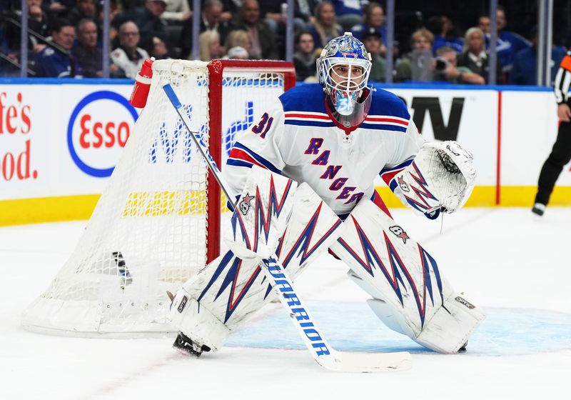 Oct 19, 2024; Toronto, Ontario, CAN; New York Rangers goaltender Igor Shesterkin (31) follows the play against the Toronto Maple Leafs during the first period at Scotiabank Arena. Mandatory Credit: Nick Turchiaro-Imagn Images