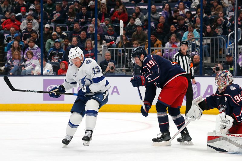 Nov 21, 2024; Columbus, Ohio, USA; Tampa Bay Lightning right wing Cam Atkinson (13) deflects the puck past Columbus Blue Jackets goalie Elvis Merzlikins (90) for a gaol during the first period at Nationwide Arena. Mandatory Credit: Russell LaBounty-Imagn Images