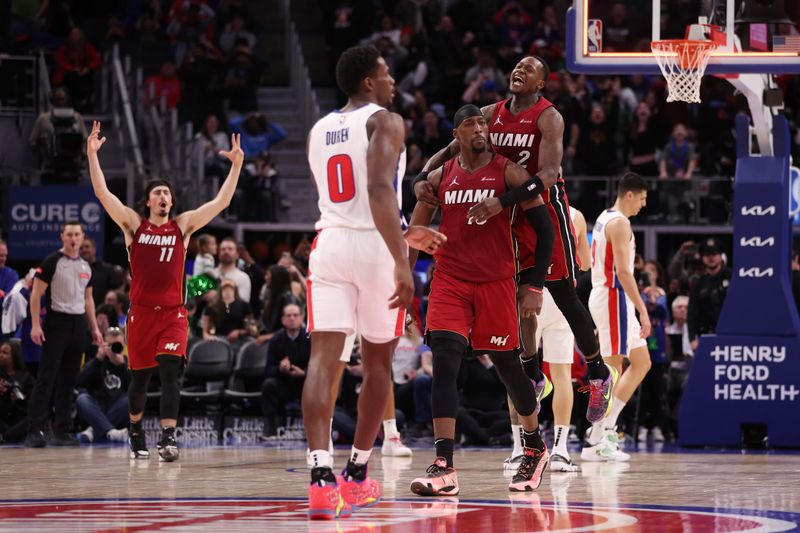 DETROIT, MICHIGAN - MARCH 17: Bam Adebayo #13 of the Miami Heat celebrates his game winning shot with Terry Rozier #2 to beat the Detroit Pistons 104-101 at Little Caesars Arena on March 17, 2024 in Detroit, Michigan. NOTE TO USER: User expressly acknowledges and agrees that, by downloading and or using this photograph, User is consenting to the terms and conditions of the Getty Images License.  (Photo by Gregory Shamus/Getty Images)