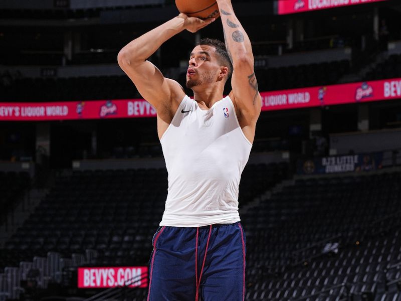 DENVER, CO - MARCH 31: Michael Porter Jr. #1 of the Denver Nuggets warms up before the game against the Cleveland Cavaliers on March 31, 2024 at the Ball Arena in Denver, Colorado. NOTE TO USER: User expressly acknowledges and agrees that, by downloading and/or using this Photograph, user is consenting to the terms and conditions of the Getty Images License Agreement. Mandatory Copyright Notice: Copyright 2024 NBAE (Photo by Garrett Ellwood/NBAE via Getty Images)