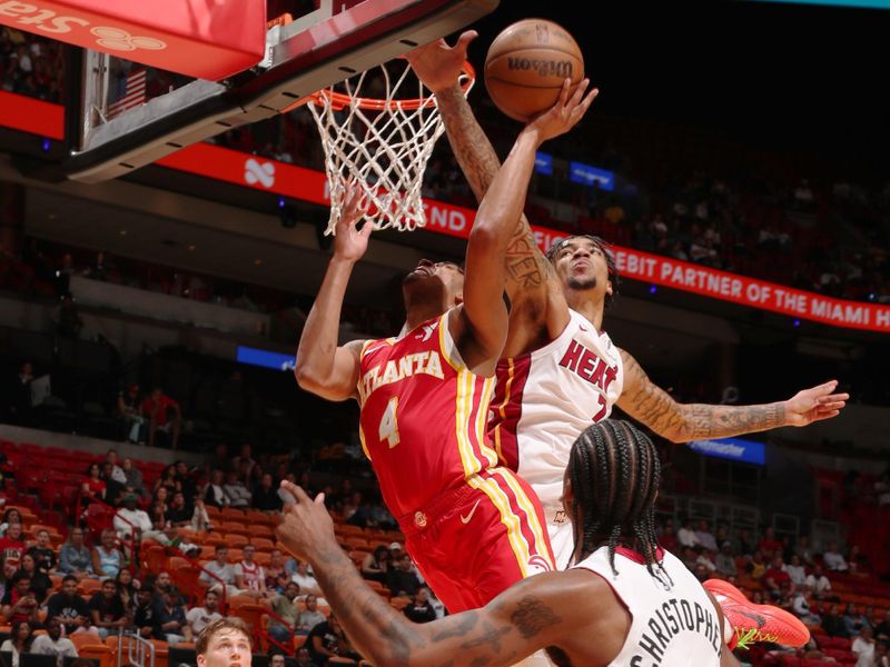 MIAMI, FL - OCTOBER 16: Kel'el Ware #7 of the Miami Heat blocks the ball during the game against the Atlanta Hawks on October 16, 2024 at Miami-Dade Arena in Miami, Florida. NOTE TO USER: User expressly acknowledges and agrees that, by downloading and or using this Photograph, user is consenting to the terms and conditions of the Getty Images License Agreement. Mandatory Copyright Notice: Copyright 2024 NBAE (Photo by Issac Baldizon/NBAE via Getty Images)