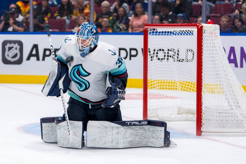 Sep 24, 2024; Vancouver, British Columbia, CAN; Seattle Kraken goalie Ales Stezka (30) makes a save against the Vancouver Canucks during the third period at Rogers Arena. Mandatory Credit: Bob Frid-Imagn Images