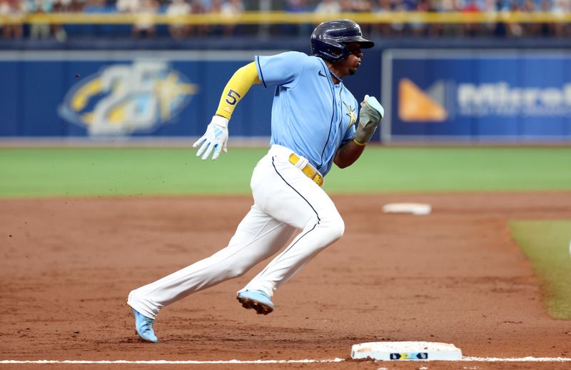 May 28, 2023; St. Petersburg, Florida, USA;Tampa Bay Rays shortstop Wander Franco (5) runs home to score a run during the second inning against the Los Angeles Dodgers  at Tropicana Field. Mandatory Credit: Kim Klement-USA TODAY Sports