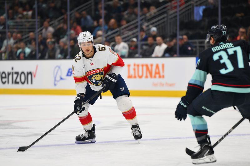 Dec 12, 2023; Seattle, Washington, USA; Florida Panthers defenseman Brandon Montour (62) looks to pass the puck during the first period against the Seattle Kraken at Climate Pledge Arena. Mandatory Credit: Steven Bisig-USA TODAY Sports.