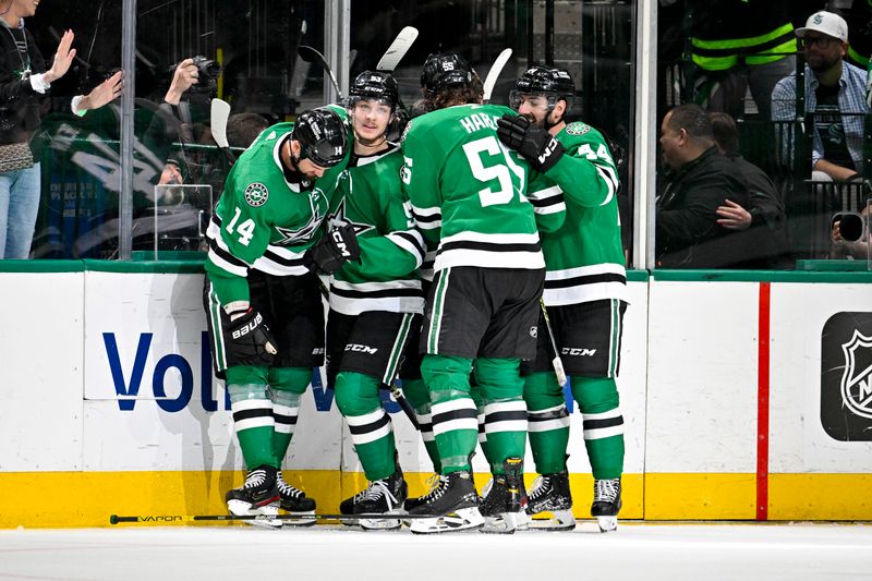 May 15, 2023; Dallas, Texas, USA; Dallas Stars center Wyatt Johnston (53) and left wing Jamie Benn (14) and defenseman Thomas Harley (55) and defenseman Joel Hanley (44) celebrate after Johnston scores the game winning goal against the Seattle Kraken during the third period in game seven of the second round of the 2023 Stanley Cup Playoffs at the American Airlines Center. Mandatory Credit: Jerome Miron-USA TODAY Sports