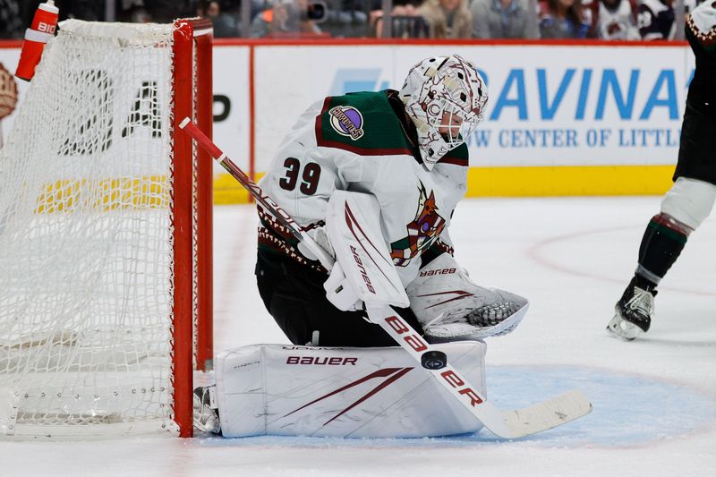 Dec 23, 2023; Denver, Colorado, USA; Arizona Coyotes goaltender Connor Ingram (39) deflects a shot in the second period against the Colorado Avalanche at Ball Arena. Mandatory Credit: Isaiah J. Downing-USA TODAY Sports