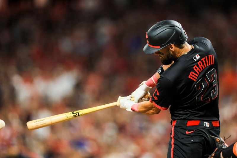 Jul 5, 2024; Cincinnati, Ohio, USA; Cincinnati Reds outfielder Nick Martini (23) hits a RBI triple in the ninth inning against the Detroit Tigers at Great American Ball Park. Mandatory Credit: Katie Stratman-USA TODAY Sports