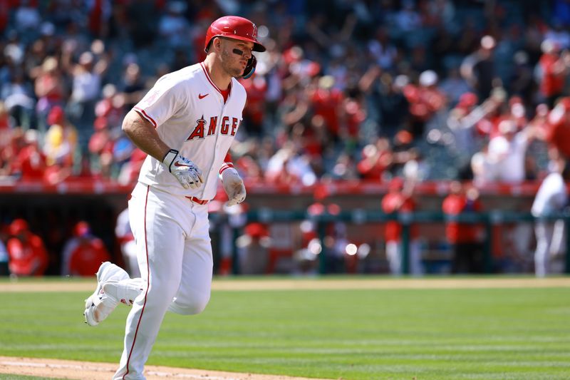 Apr 24, 2024; Anaheim, California, USA;  Los Angeles Angels designated hitter Mike Trout (27) runs around bases after hitting a home run during the sixth inning against the Baltimore Orioles at Angel Stadium. Mandatory Credit: Kiyoshi Mio-USA TODAY Sports
