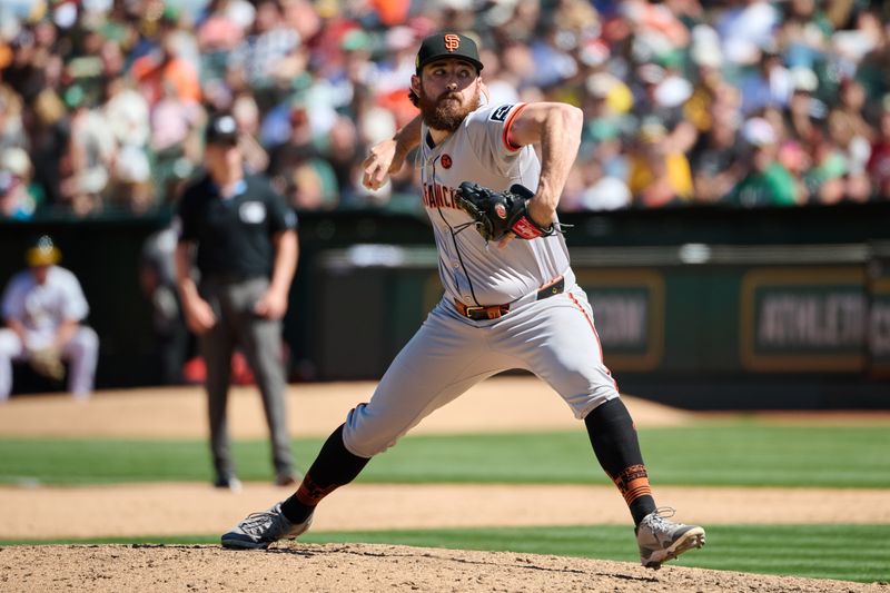 Aug 18, 2024; Oakland, California, USA; San Francisco Giants pitcher Ryan Walker (74) throws a pitch against the Oakland Athletics during the ninth inning at Oakland-Alameda County Coliseum. Mandatory Credit: Robert Edwards-USA TODAY Sports