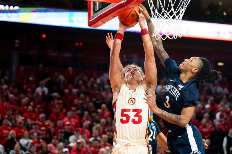 Feb 17, 2024; Lincoln, Nebraska, USA; Nebraska Cornhuskers forward Josiah Allick (53) shoots the ball against Penn State Nittany Lions guard Nick Kern Jr. (3) during the first half at Pinnacle Bank Arena. Mandatory Credit: Dylan Widger-USA TODAY Sports